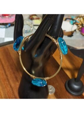 Gold tone Wired wrapped bangle bracelet 8" W Blue Stones